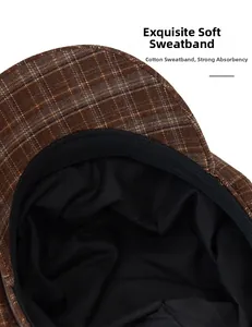 Detail view of the black cotton sweatband inside the brown plaid beret cap for women