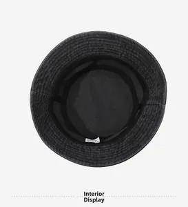Detailed interior view of washed denim bucket hat showing cotton sweatband and stitching