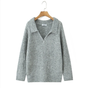 Minimalist grey knit sweater with polo collar and long sleeves in a relaxed fit