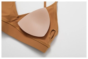 Detail view of quick-dry sports bra with removable pads and smooth stitching details