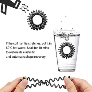 Black spiral elastic hair tie shown with heat recovery feature in hot water