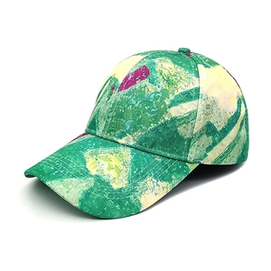 Detail of colorful tie-dye baseball cap with vibrant green, yellow, and purple patterns
