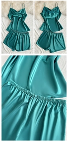 Detail of dark green satin sleepwear set showing smooth fabric and elastic waistband