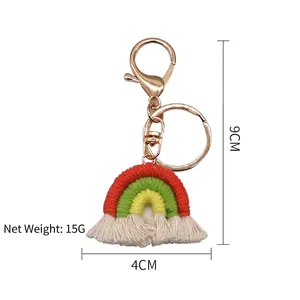 Handmade woven rainbow keychain with white tassels and rose gold lobster clasp