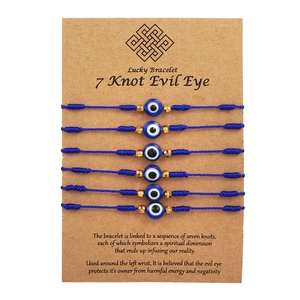 Set of 6 adjustable blue evil eye friendship bracelets on craft card packaging