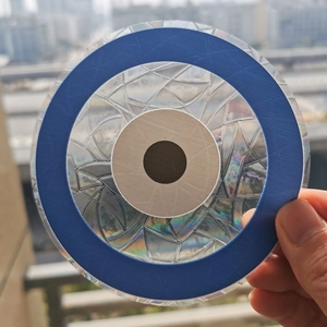 Rainbow suncatcher prism glass sticker with concentric circle pattern in sunlight