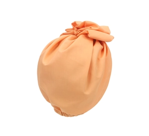 Detail of light orange fabric turban with soft pleats and elasticated hair care band