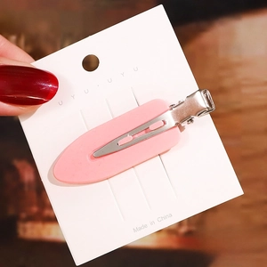 Close-up of 6cm pink acetate hair clip on display card showing metal alligator mechanism