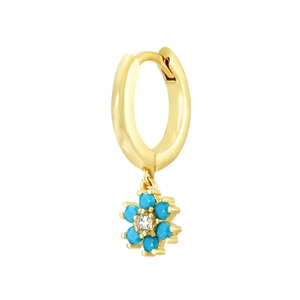 Detail view of a gold hoop earring with a sky blue flower pendant and clear zircon center