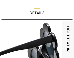 Detail shot of black flower shaped sunglasses frame with high gloss and light texture
