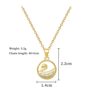 Detail shot of golden swan necklace with dimensions 1.4cm by 2.2cm and weight 3.2g