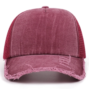 Distressed washed rose red baseball cap with mesh back and vintage frayed brim detail