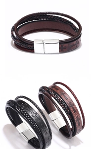 Detailed view of multilayer woven leather bracelets with cross pattern and magnetic clasp
