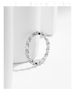 Macro detail of S925 sterling silver eternity ring with sparkling zircon stone setting
