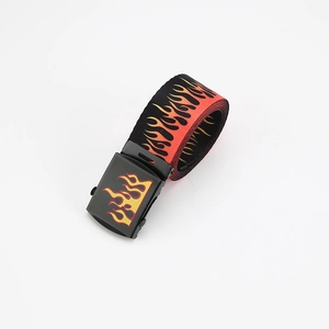 Detailed close-up of a black canvas belt featuring vibrant flame patterns and metal buckle