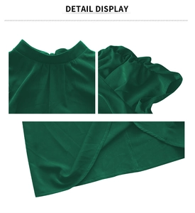 Detail display of women's green blouse featuring round neck and ruffle cuffs