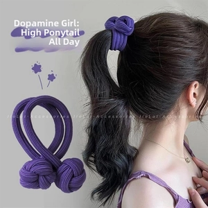 Close-up of a durable purple braided hair tie with matching sphere accents for high ponytail