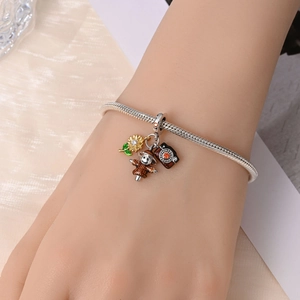 Silver snake chain bracelet featuring sunflower, scarecrow and camera pendants