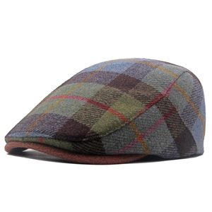 Close-up of wool blend beret featuring retro plaid patterns and brown brim texture