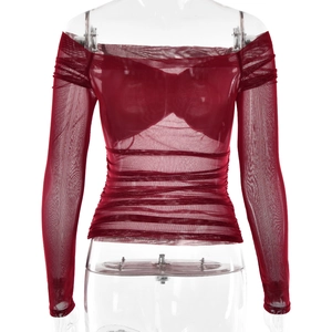 Detail showing the sheer mesh red off-shoulder long sleeve top with pleated texture