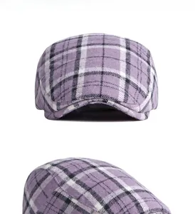 Close-up multi-angle view of a purple wool plaid beret hat showing tweed texture