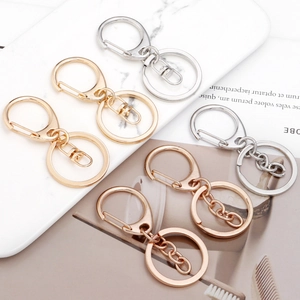 Three-piece set of D-shaped lobster clasp keychains in gold, silver, and rose gold finishes