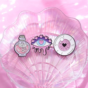 Cartoon purple enamel pins set with potion bottle and heart eye design for accessories