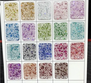 Macro view of 19 glitter acrylic color samples with numbered codes for clipboards