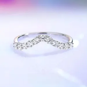 Close-up of V-shaped S925 sterling silver ring with oval brilliant zirconia stones