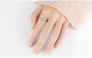 Detail of adjustable star and moon spinner ring with zircons for anxiety relief