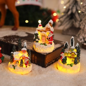 Miniature resin Christmas gingerbread houses with LED lights and Santa figurines set