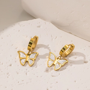 Golden butterfly earrings set with white mother of pearl inlay on a natural stone base