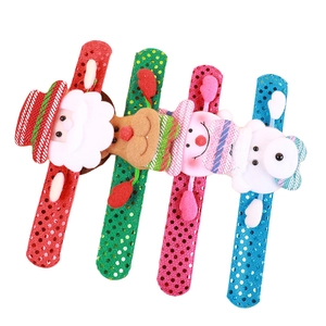 Set of 4 festive LED Christmas slap bracelets with plush Santa, Reindeer, and Snowman