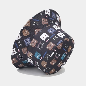 Reversible bucket hat featuring colorful cartoon cat prints on black durable fabric