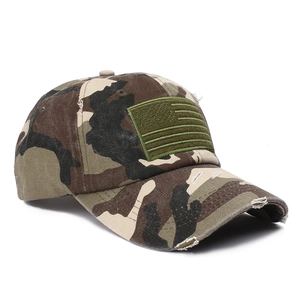 Detail of distressed camouflage baseball cap featuring tactical American flag embroidery