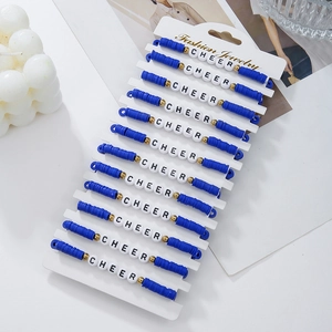 Close-up of 12-piece blue and white clay bead bracelets with CHEER letter beads