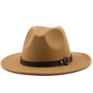 Detail of camel wool fedora hat featuring black leather band and gold circular buckle