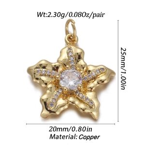 Macro view of gold-plated copper starfish charm with dimensions and crystal inlay detail