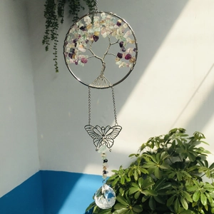 Detailed shot of Tree of Life suncatcher with color stone leaves and crystal prism