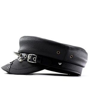 Detailed close-up of punk leather captain hat with silver studs and metal buckle texture