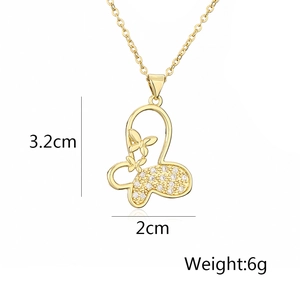 Detail view of a gold-plated butterfly pendant showing 3.2cm size and 6g weight