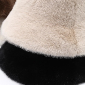 Close-up of fluffy faux fur bucket hats showing soft plush texture in multiple colors