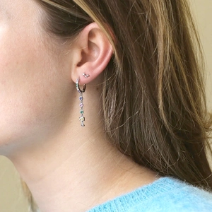Elegant S925 silver needle drop earrings with colorful zircon tassels worn by a model