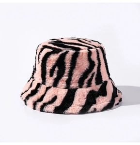 Detail of pink and black zebra print faux fur bucket hat with soft plush texture