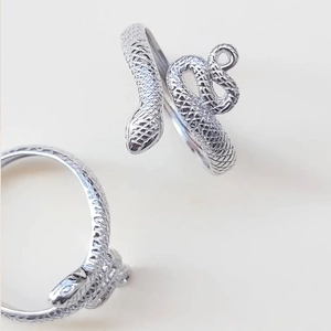 Adjustable snake ring in silver finish with detailed scale texture and open design