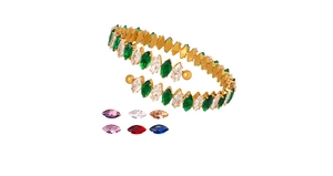 Detail of gold-plated bangle featuring marquise-cut green and white zircon gemstones