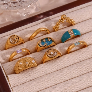 Detailed set of 18K gold plated steel rings with star, moon, turquoise, and pearl inlays