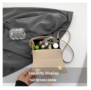 Interior view showing capacity of the beige crossbody bag with smartphone and cosmetics