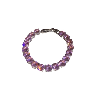 Elegant silver tennis bracelet featuring round purple zircon stones with a secure folding clasp