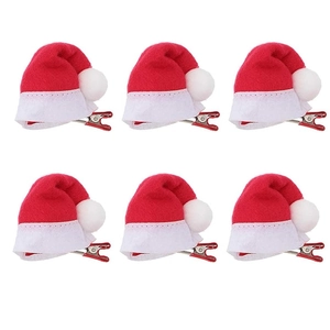 Set of six mini red Christmas hat hair clips with white trim on a white background